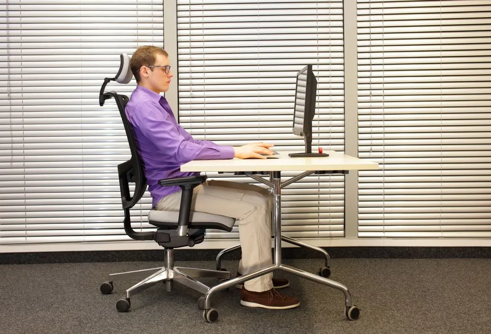 Ergonomic desk workspace with aligned monitor, chair, and neutral sitting posture